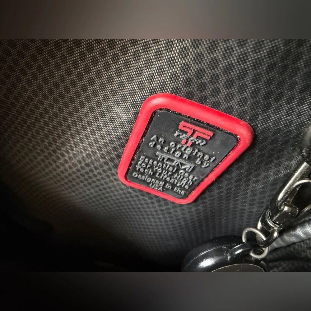 Tumi T-Tech sling bag with multiple compartments and Keychain mens